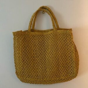 Handmade woven summer basket bag in mustard yellow.